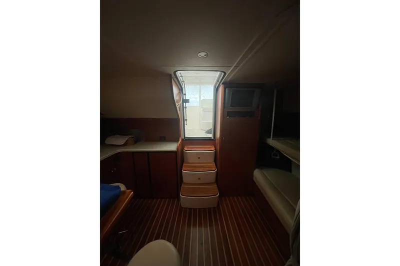 Slide: The Image of Engine compartment of a 2006 Tiara Yachts 3800 Open, showcasing mechanical components. - 38