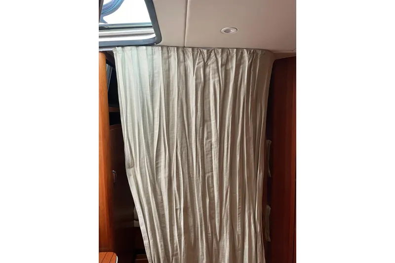 Slide: The Image of Engine compartment of a 2006 Tiara Yachts 3800 Open, showcasing detailed mechanical components. - 39