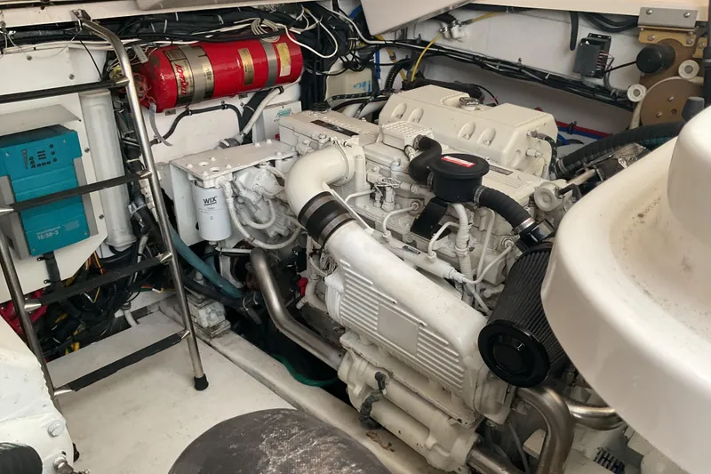Slide: The Image of Engine room of a 2006 Tiara Yachts 3800 Open, showcasing batteries and engine components. - 41