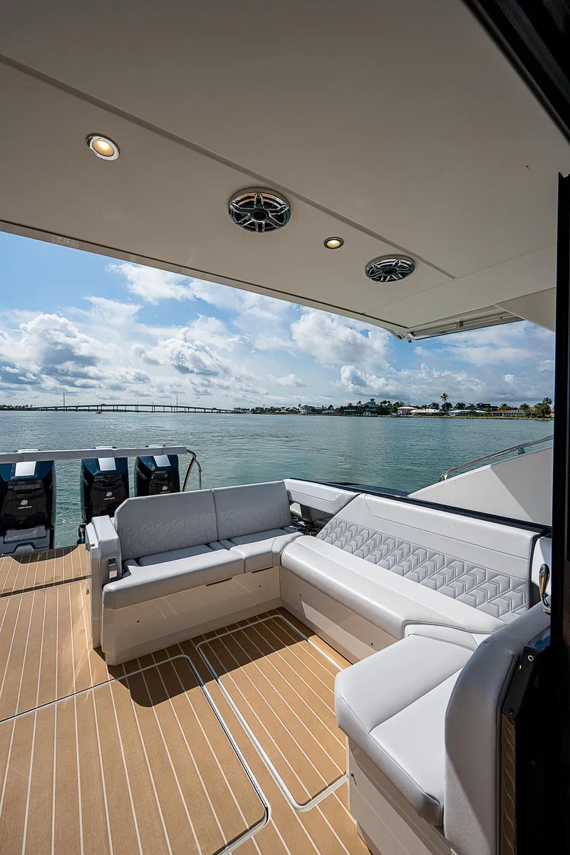 Slide: The Image of 2022 Formula 500 Super Sport Crossover yacht with luxurious seating and scenic water view. - 10