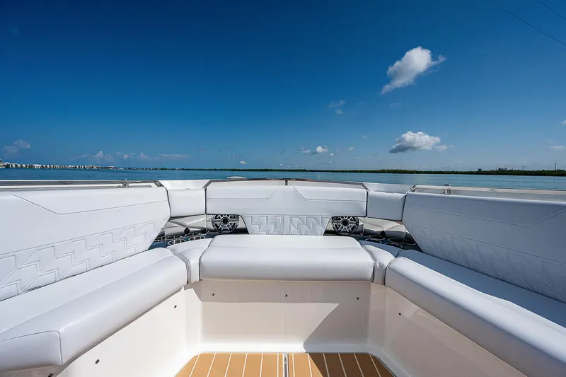 Slide: The Image of 2022 Formula 500 Super Sport Crossover boat interior with white seating and ocean view. - 13