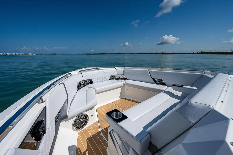 Slide: The Image of Luxurious 2022 Formula 500 Super Sport Crossover boat interior on calm water. - 14