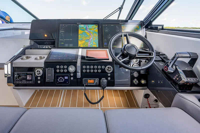Slide: The Image of 2022 Formula 500 Super Sport Crossover helm with advanced navigation displays and controls. - 2