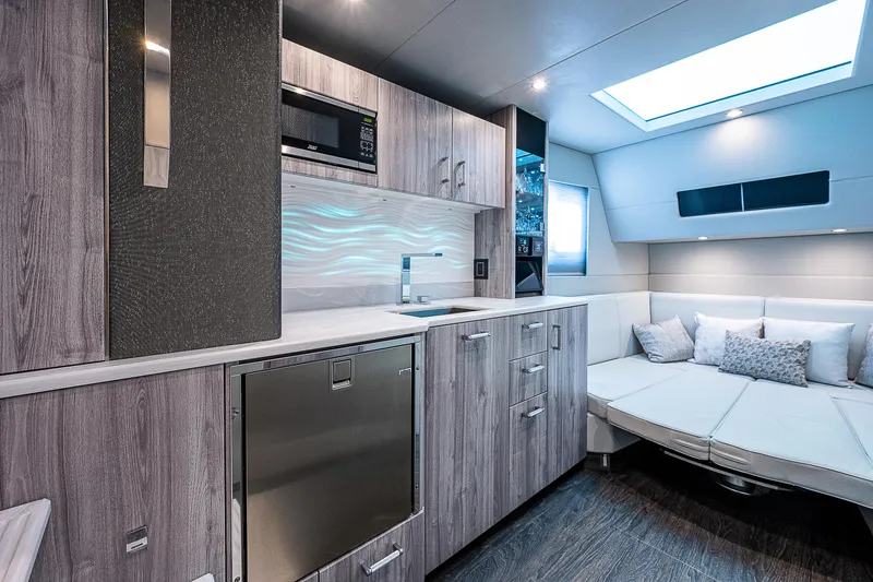 Slide: The Image of Luxurious interior of 2022 Formula 500 Super Sport Crossover with modern kitchen and seating area. - 21