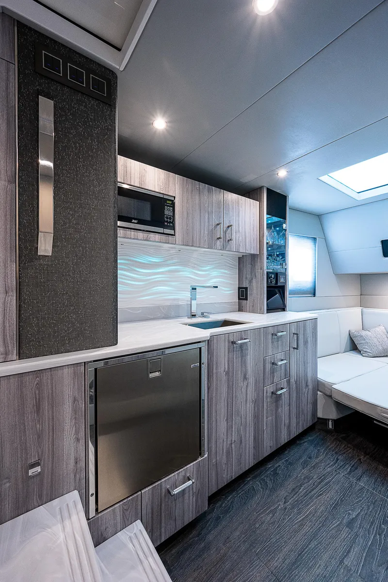 Slide: The Image of Luxurious interior of 2022 Formula 500 Super Sport Crossover yacht with modern kitchen amenities. - 22