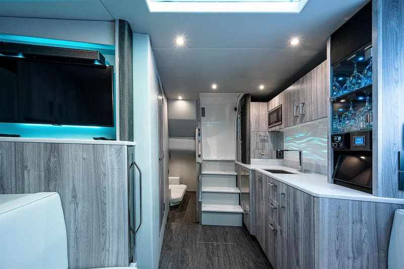 Slide: The Image of Luxurious interior of 2022 Formula 500 Super Sport Crossover with modern kitchen and sleek design. - 23