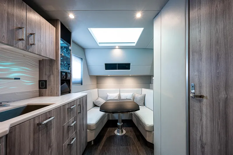Slide: The Image of Luxurious interior of 2022 Formula 500 Super Sport Crossover yacht with modern seating and skylight. - 25
