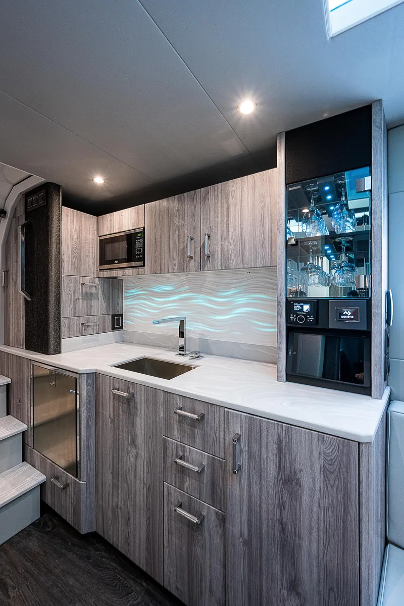 Slide: The Image of Modern kitchen in 2022 Formula 500 Super Sport Crossover with sleek cabinetry and ambient lighting. - 28
