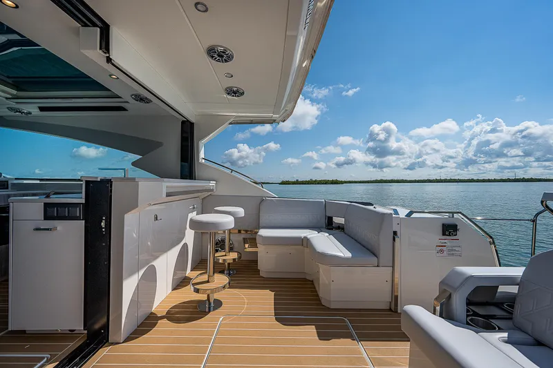 Slide: The Image of Luxury 2022 Formula 500 Super Sport Crossover yacht interior with seating and ocean view. - 35