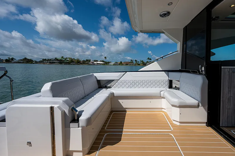 Slide: The Image of 2022 Formula 500 Super Sport Crossover yacht with spacious deck seating and scenic water view. - 36