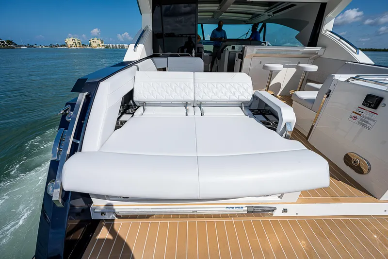 Slide: The Image of 2022 Formula 500 Super Sport Crossover luxury yacht with spacious sunbed and sleek design. - 42