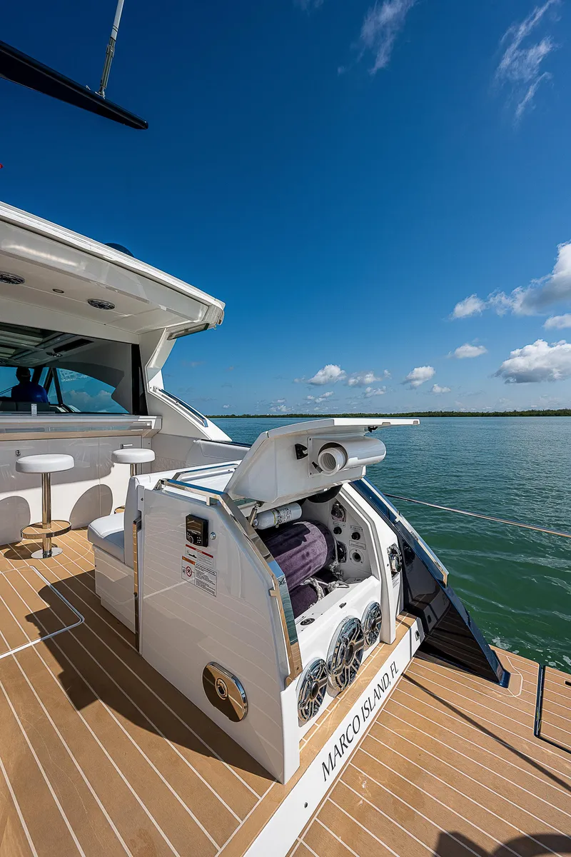 Slide: The Image of 2022 Formula 500 Super Sport Crossover yacht on open water, sunny day. - 43