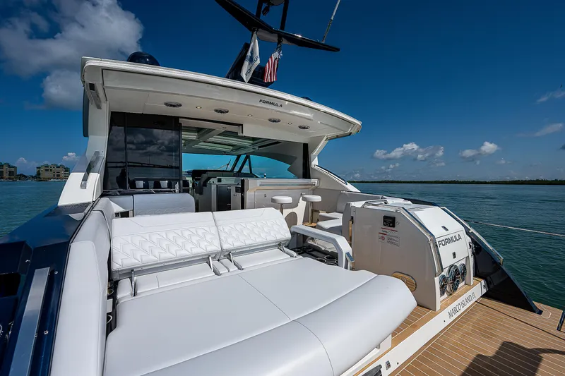 Slide: The Image of 2022 Formula 500 Super Sport Crossover yacht with luxurious seating on open water. - 46