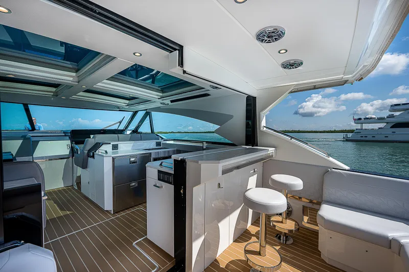 Slide: The Image of Luxurious 2022 Formula 500 Super Sport Crossover yacht interior with modern seating and ocean view. - 49