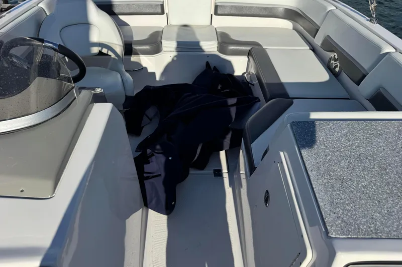 Slide: The Image of 2018 Chaparral 19 SSi Ski & Fish OB interior with seating and console. - 5