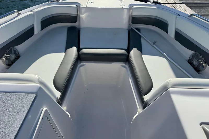 Slide: The Image of 2018 Chaparral 19 SSi Ski & Fish OB boat interior with cushioned seating. - 4