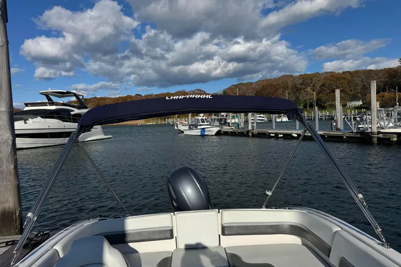 Slide: The Image of 2018 Chaparral 19 SSi Ski & Fish OB boat docked in a scenic marina. - 6