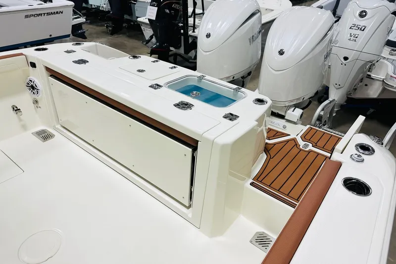 Slide: The Image of 2026 Cobia 265 Center Console boat interior with Yamaha outboard engines. - 14