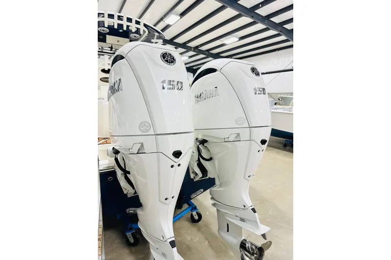 Slide: The Image of Twin Yamaha 150 outboard engines on a 2026 Cobia 265 Center Console boat. - 17