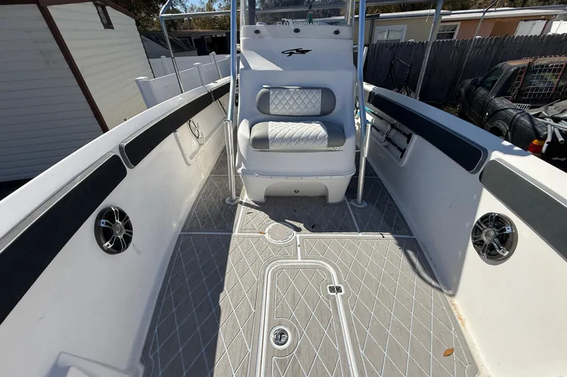 Slide: The Image of 2003 Glasstream 273 SCX boat interior with cushioned seating and modern design. - 100