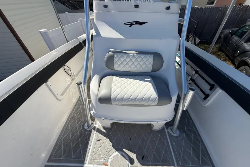 Slide: The Image of 2003 Glasstream 273 SCX boat interior with cushioned seating and sleek design. - 102