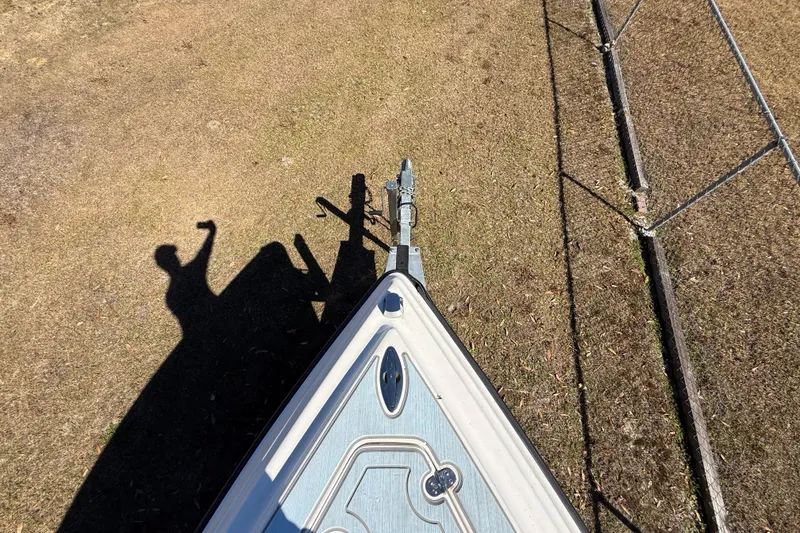 Slide: The Image of Top view of 2003 Glasstream 273 SCX boat on grass with shadow and fence. - 122