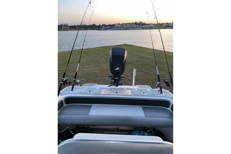 Slide: The Image of 2003 Glasstream 273 SCX boat on trailer, parked outdoors in a residential area. - 14