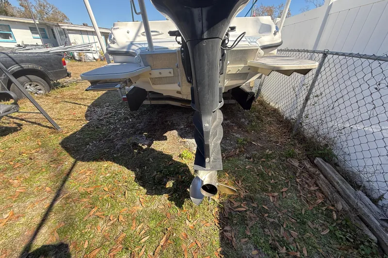 Slide: The Image of Rear view of a 2003 Glasstream 273 SCX boat with outboard motor. - 20