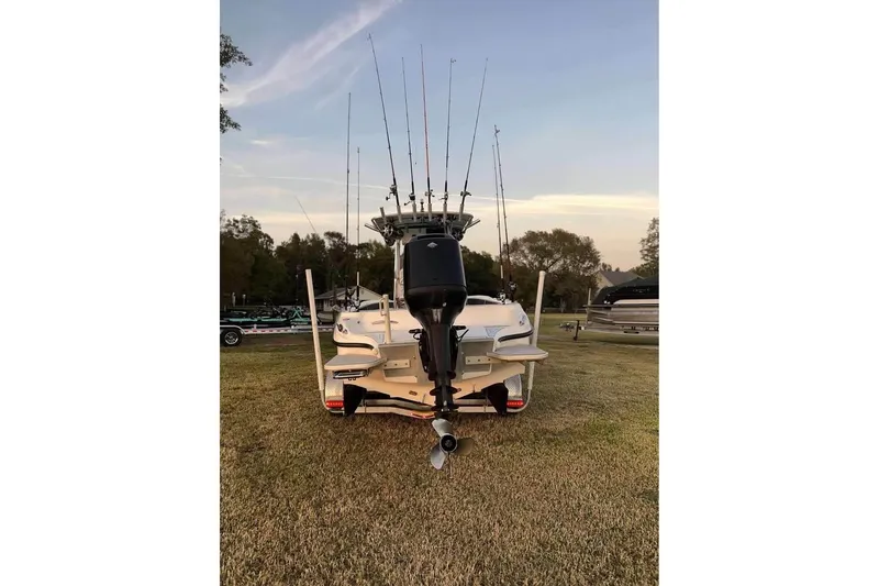 Slide: The Image of 2003 Glasstream 273 SCX boat on trailer, side view, sunny day. - 3
