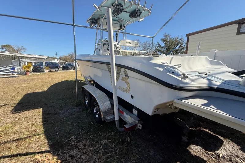 Slide: The Image of 2003 Glasstream 273 SCX boat on trailer in sunny yard setting. - 41