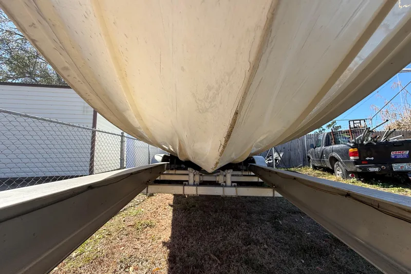 Slide: The Image of Underneath view of a 2003 Glasstream 273 SCX boat on a trailer. - 45