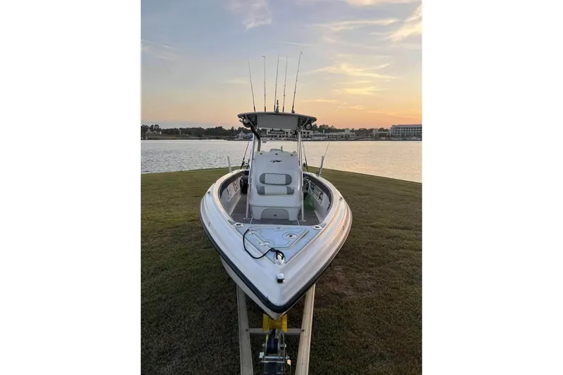 Slide: The Image of 2003 Glasstream 273 SCX boat on trailer in sunny yard. - 5