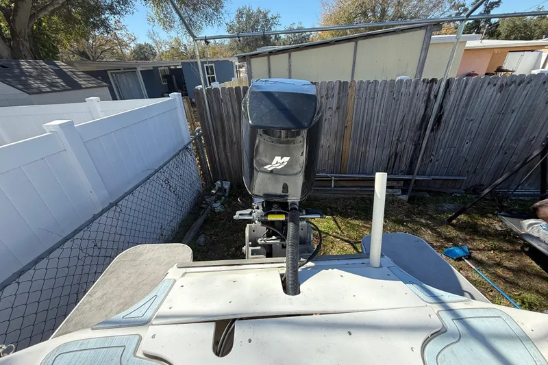 Slide: The Image of 2003 Glasstream 273 SCX boat engine in a backyard setting. - 51