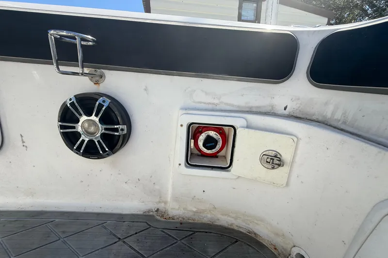 Slide: The Image of Interior of 2003 Glasstream 273 SCX boat showing speaker and control panel. - 62