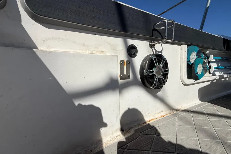 Slide: The Image of Interior view of a 2003 Glasstream 273 SCX boat, featuring speakers and storage. - 66