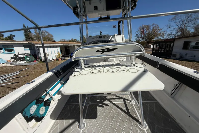 Slide: The Image of 2003 Glasstream 273 SCX boat interior with rod holders and seating. - 75