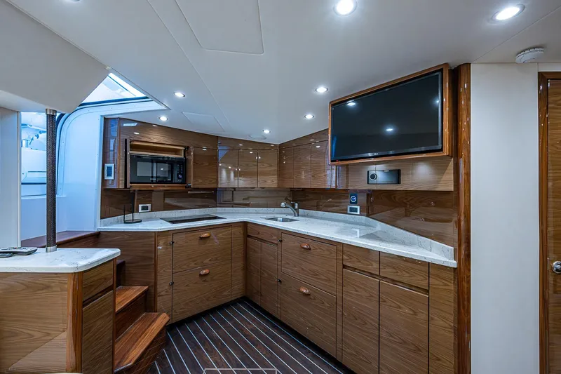 Slide: The Image of Luxurious interior of 2023 Viking 48 Sport Tower yacht with modern kitchen and sleek design. - 11