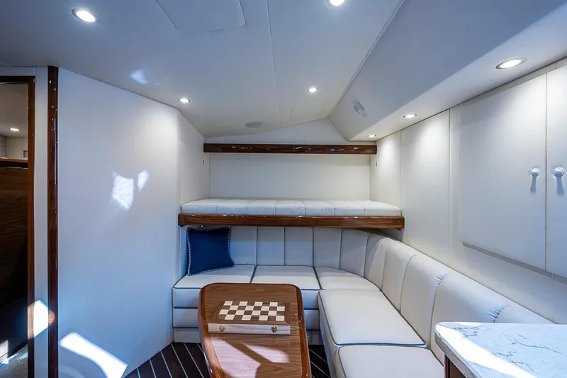 Slide: The Image of Luxurious interior of 2023 Viking 48 Sport Tower yacht with cozy seating and chessboard. - 13