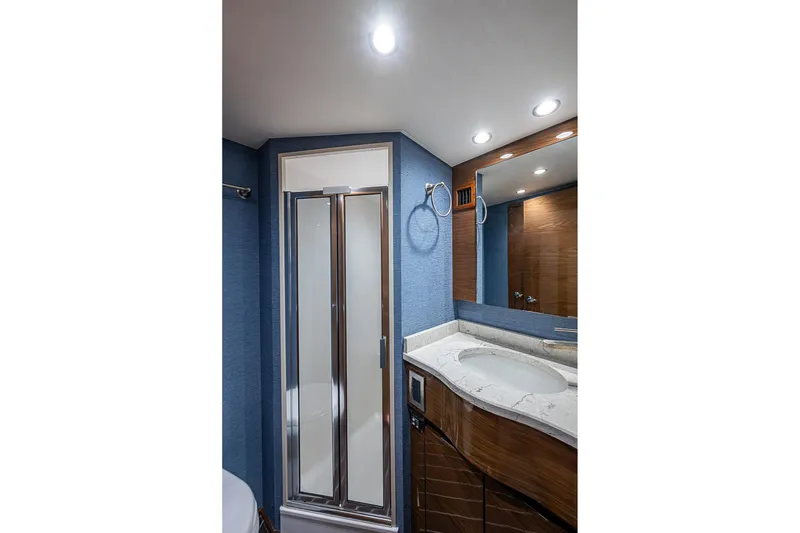 Slide: The Image of Luxurious bathroom in 2023 Viking 48 Sport Tower yacht with modern shower and vanity. - 15