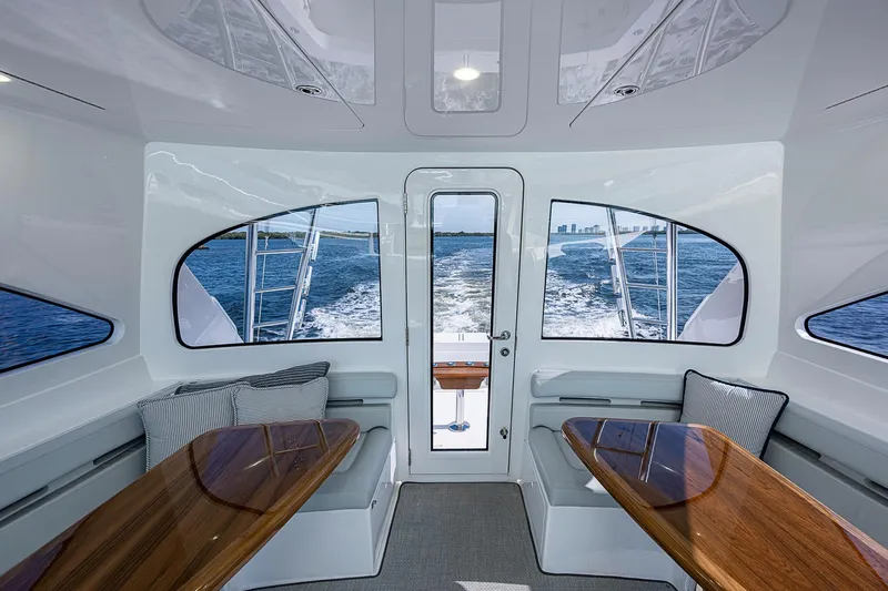 Slide: The Image of Interior of 2023 Viking 48 Sport Tower yacht with ocean view through windows. - 26