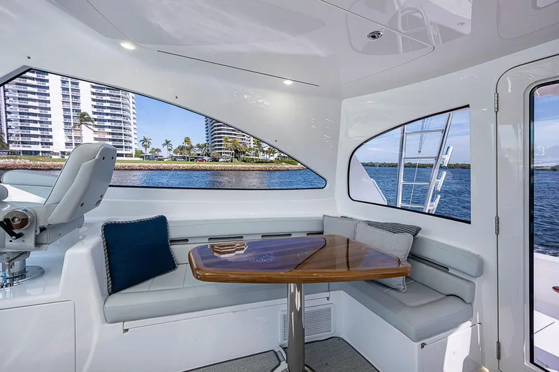 Slide: The Image of Interior of 2023 Viking 48 Sport Tower yacht with seating and waterfront view. - 27