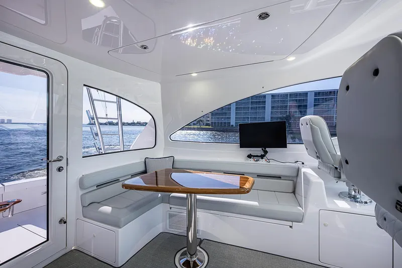 Slide: The Image of Luxurious interior of 2023 Viking 48 Sport Tower yacht with seating and ocean view. - 28