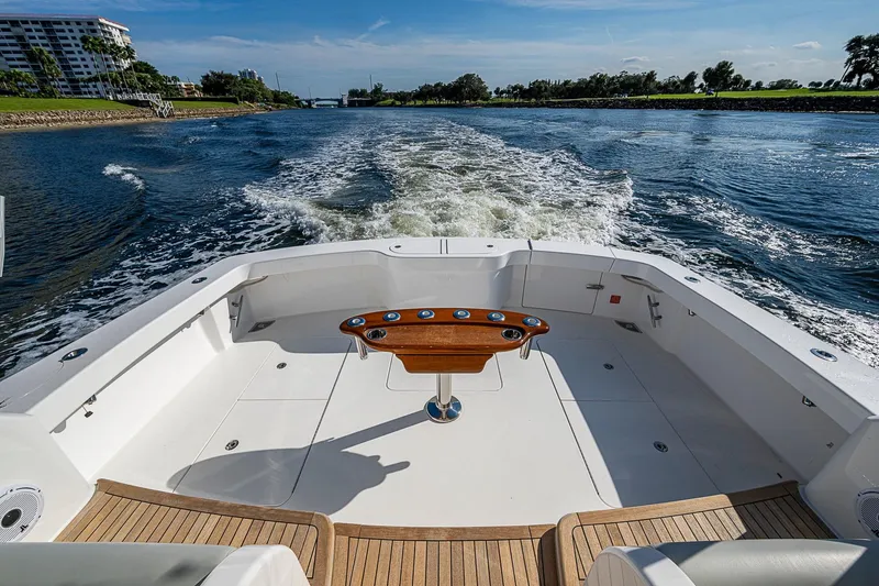 Slide: The Image of 2023 Viking 48 Sport Tower yacht cruising on a sunny day. - 33