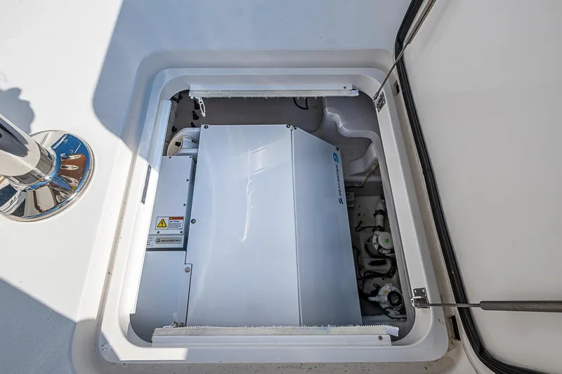 Slide: The Image of 2023 Viking 48 Sport Tower engine compartment with visible machinery and components. - 41