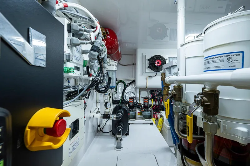 Slide: The Image of Engine room of 2023 Viking 48 Sport Tower, showcasing advanced mechanical systems and components. - 50