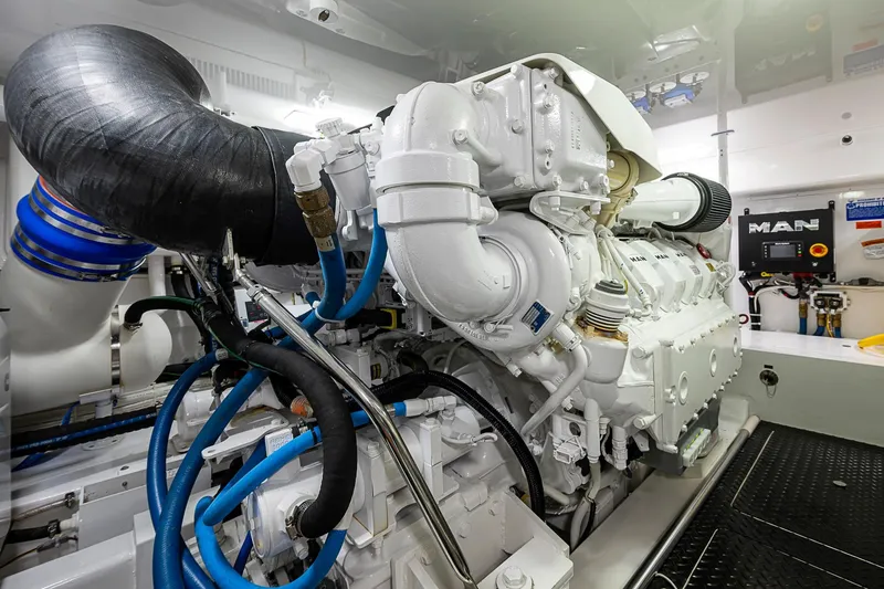 Slide: The Image of Engine room of 2023 Viking 48 Sport Tower yacht, featuring advanced machinery and components. - 53