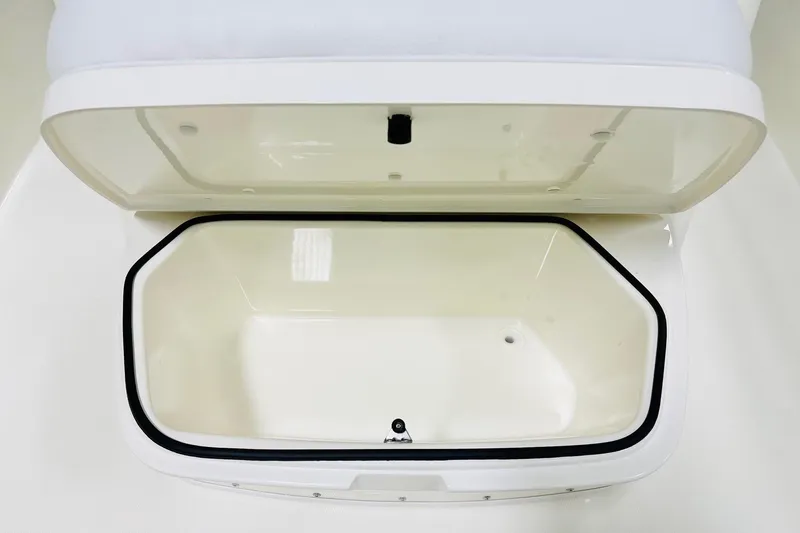 Slide: The Image of Open storage compartment on 2026 Cobia 285 Center Console boat. - 11