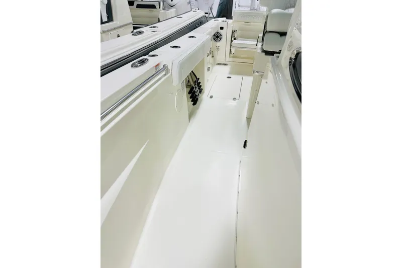 Slide: The Image of 2026 Cobia 285 Center Console boat interior with sleek white design and modern features. - 13