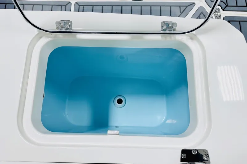 Slide: The Image of Livewell on 2026 Cobia 285 Center Console boat, open lid view. - 15