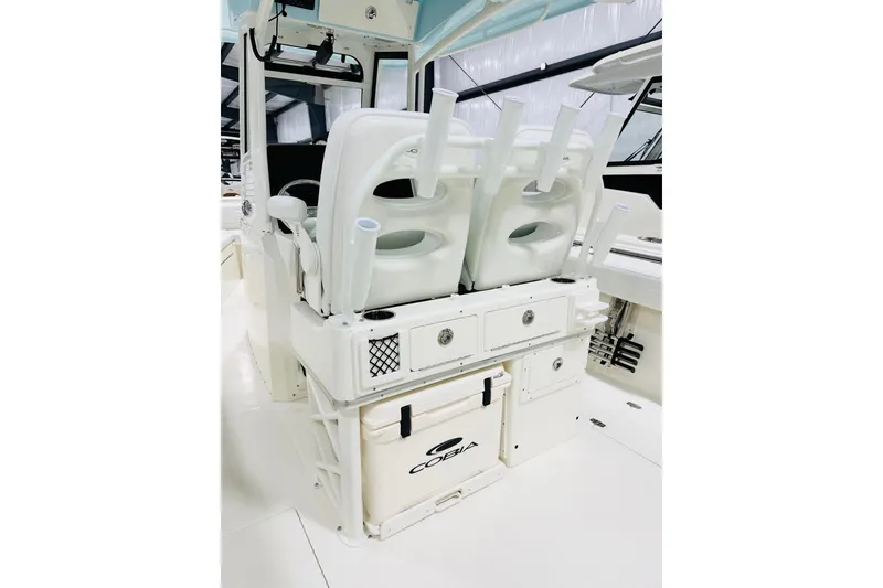 Slide: The Image of 2026 Cobia 285 Center Console boat interior with seating and storage features. - 5